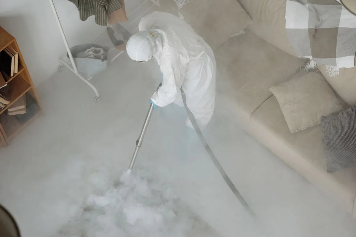 Biohazard cleanup technician in protective equipment, Cadott, WI